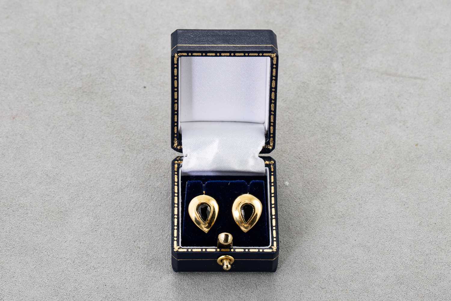 Lot 37 - A PAIR OF SAPPHIRE EARRINGS, the bezel set...