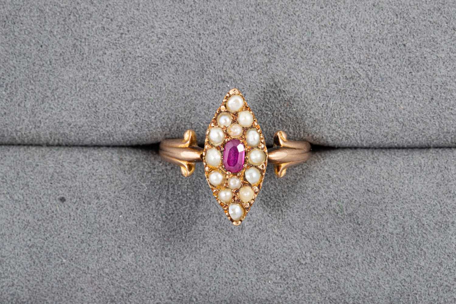 Lot 63 - A PEARL AND RUBY NAVETTE SHAPED RING, the seed...