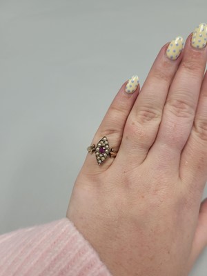 Lot 63 - A PEARL AND RUBY NAVETTE SHAPED RING, the seed...