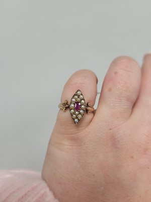 Lot 63 - A PEARL AND RUBY NAVETTE SHAPED RING, the seed...