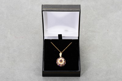 Lot 71 - AN AMETHYST AND PEARL CLUSTER PENDANT, mounted...