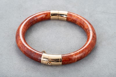 Lot 73 - A JADE BANGLE, with a 14ct gold clasp and...