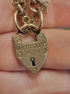 Lot 77 - A 9CT GOLD CURB LINK BRACELET, engraved...