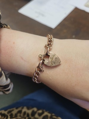 Lot 77 - A 9CT GOLD CURB LINK BRACELET, engraved...