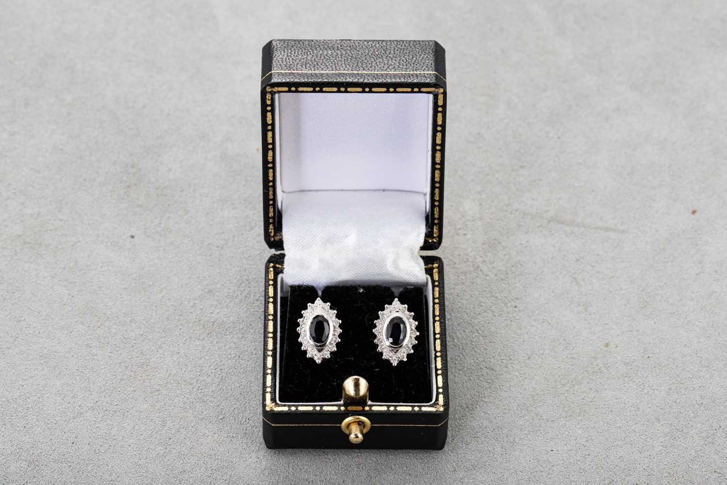 Lot 97 - A PAIR OF SAPPHIRE AND DIAMOND CLUSTER...
