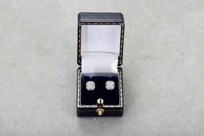 Lot 101 - A PAIR OF DIAMOND CLUSTER EARRINGS, set with...