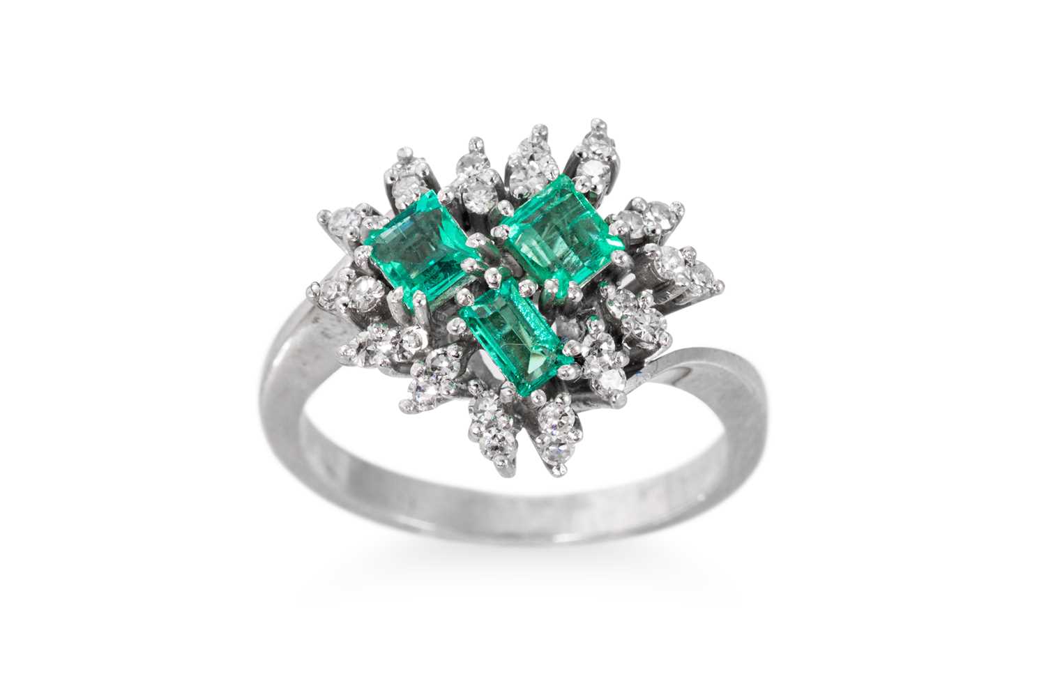 Lot 179 - AN EMERALD AND DIAMOND CLUSTER RING, set with...