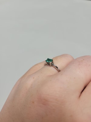 Lot 181 - AN EMERALD RING, the rectangular emerald...