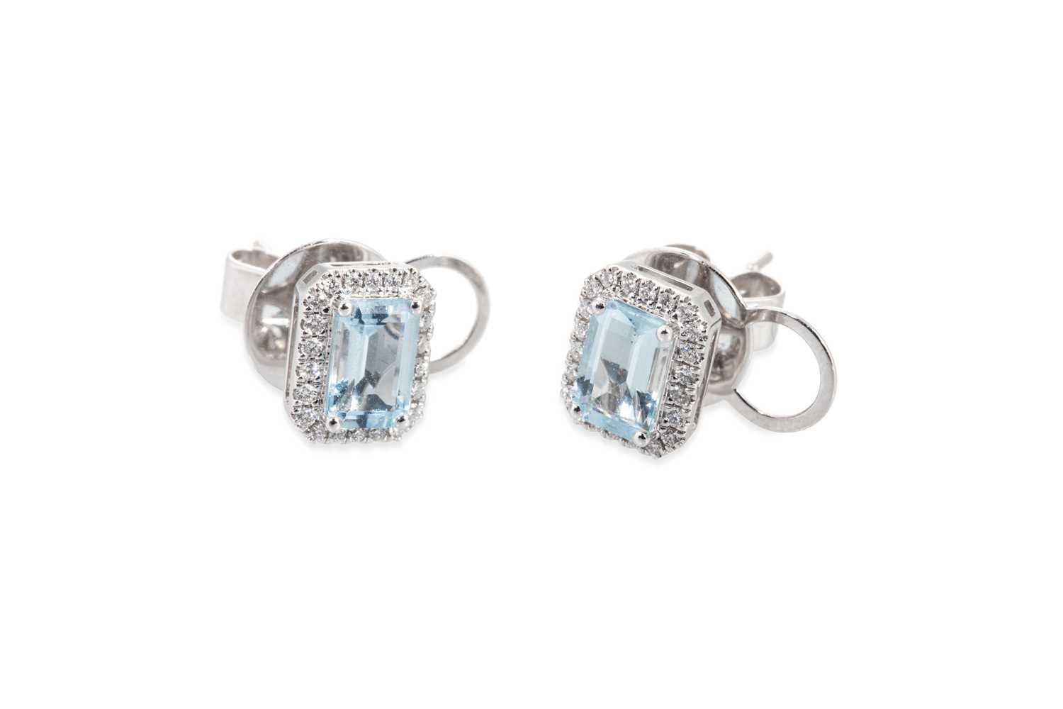 Lot 132 - A PAIR OF AQUAMARINE AND DIAMOND CLUSTER...