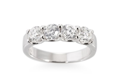 Lot 300 - A FOUR STONE DIAMOND RING, the brilliant cut...