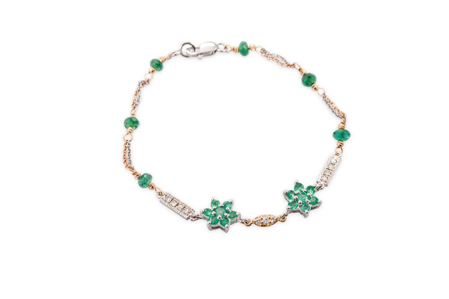 Lot 110 - AN EMERALD AND DIAMOND BRACELET, comprising...