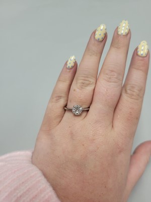 Lot 154 - A DIAMOND CLUSTER RING, set with marquise and...