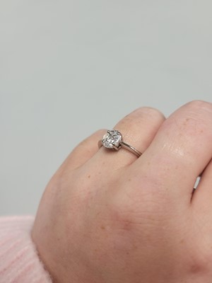 Lot 154 - A DIAMOND CLUSTER RING, set with marquise and...