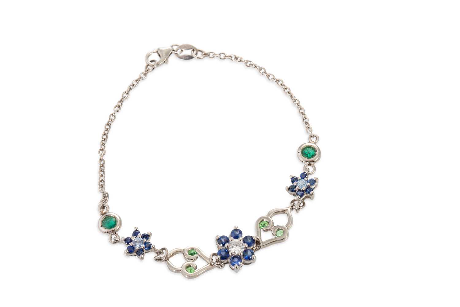 Lot 157 - A SAPPHIRE AND EMERALD BRACELET, of cluster...