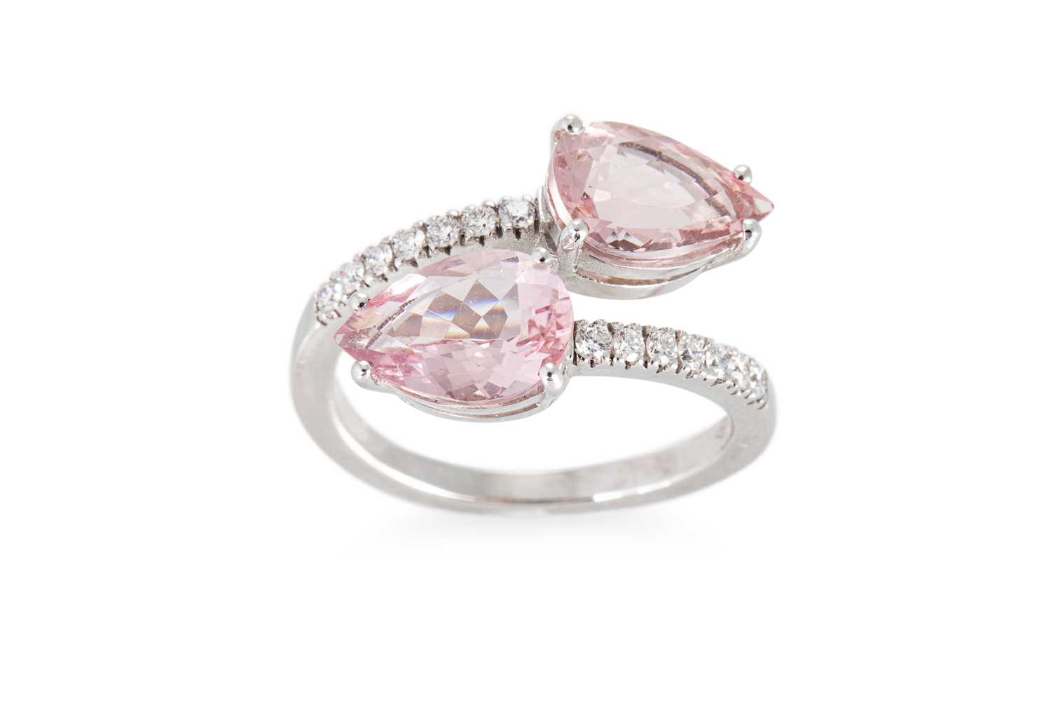 Lot 158 - A MORGANITE AND DIAMOND RING, of cross over...