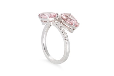 Lot 158 - A MORGANITE AND DIAMOND RING, of cross over...
