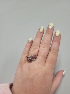 Lot 158 - A MORGANITE AND DIAMOND RING, of cross over...