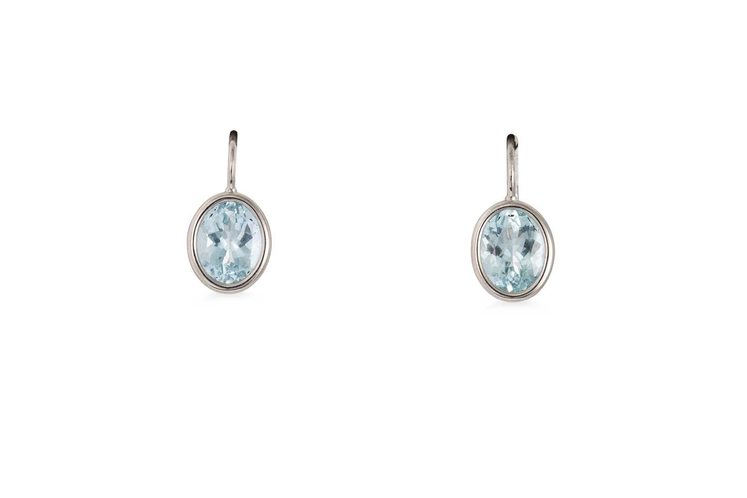 Lot 160 - A PAIR OF AQUAMARINE EARRINGS, the oval...
