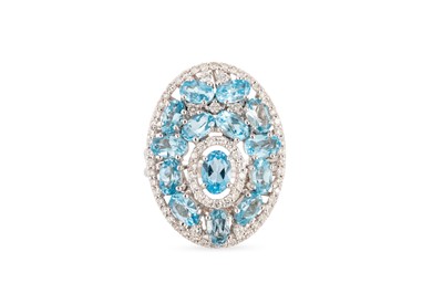 Lot 317 - A TOPAZ AND DIAMOND CLUSTER RING, mounted in...