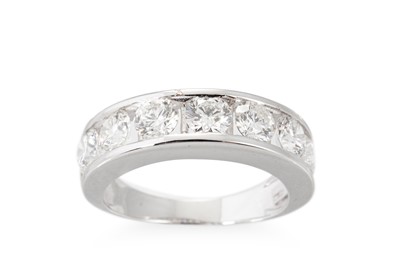 Lot 318 - A DIAMOND HALF ETERNITY RING, the brilliant...