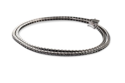 Lot 128 - A BLACK DIAMOND LINE NECKLACE, set with...