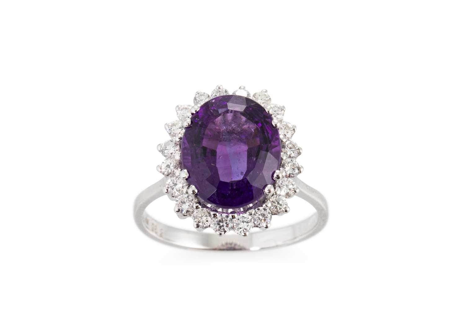 Lot 116 - AN AMETHYST AND DIAMOND RING, the oval...