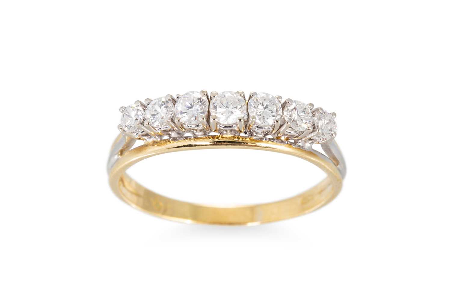 Lot 121 - A VINTAGE SEVEN STONE DIAMOND RING, the...