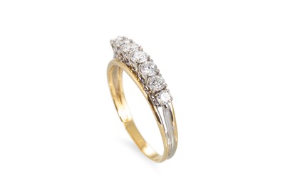 Lot 121 - A VINTAGE SEVEN STONE DIAMOND RING, the...