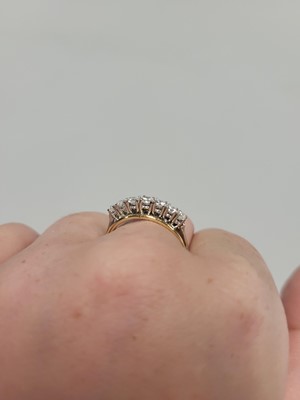 Lot 121 - A VINTAGE SEVEN STONE DIAMOND RING, the...