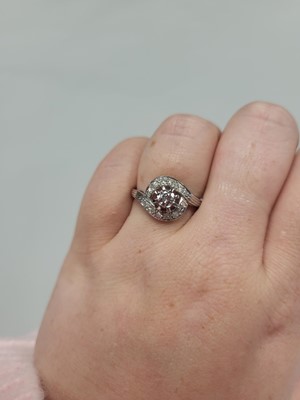 Lot 121 - A VINTAGE SEVEN STONE DIAMOND RING, the...