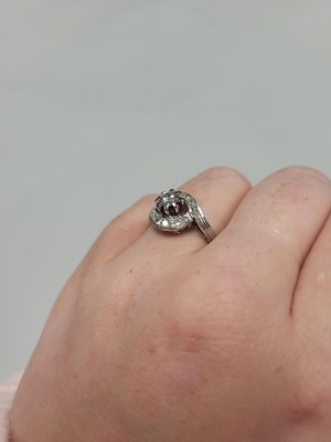 Lot 123 - A DIAMOND CLUSTER RING, of twist design, 14ct...