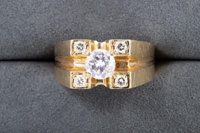 Lot 57 - A DIAMOND SET RING, the central brilliant cut...