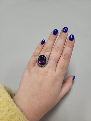 Lot 68 - AN AMETHYST AND DIAMOND CLUSTER RING, the...