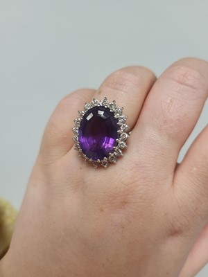 Lot 68 - AN AMETHYST AND DIAMOND CLUSTER RING, the...