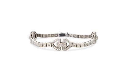 Lot 170 - A DIAMOND CLUSTER BRACELET, with geometric...