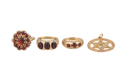 Lot 116 - THREE ASSORTED GARNET RINGS, mounted in 9ct...