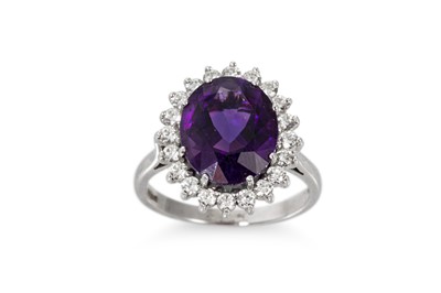 Lot 210 - AN AMETHYST AND DIAMOND CLUSTER RING, mounted...