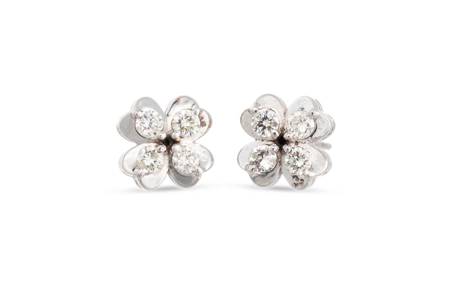 Lot 34 - A PAIR OF DIAMOND SET EARRINGS, of four leaf...