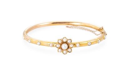 Lot 30 - A LATE VICTORIAN PEARL SET BANGLE, with...