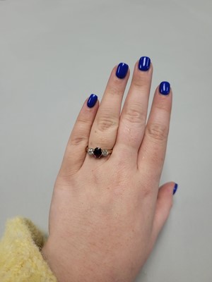 Lot 95 - A RUBY AND DIAMOND THREE STONE RING, the oval...