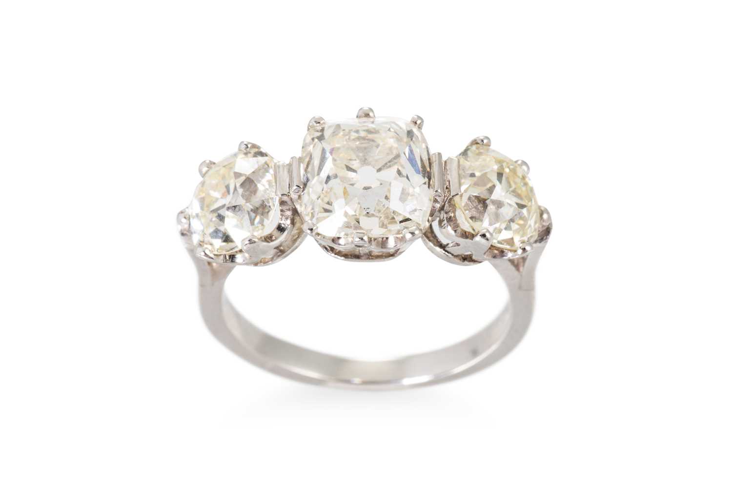 Lot 229 - AN OLD CUT DIAMOND THREE STONE RING, the...
