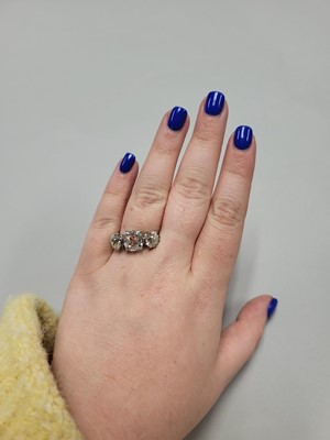 Lot 229 - AN OLD CUT DIAMOND THREE STONE RING, the...