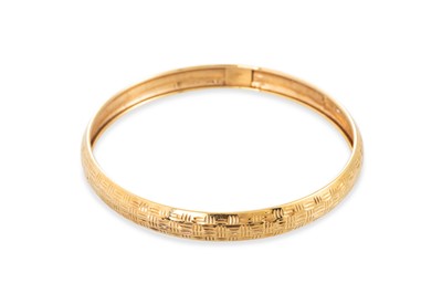 Lot 320 - A 9CT YELLOW GOLD BANGLE, with textured finish,...
