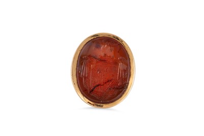 Lot 84 - AN ANTIQUE CARNELIAN INTAGLIO SEAL RING,...