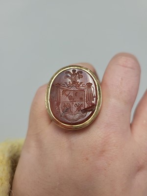 Lot 84 - AN ANTIQUE CARNELIAN INTAGLIO SEAL RING,...