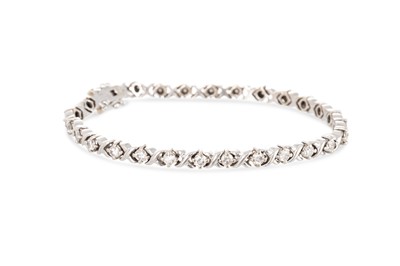 Lot 256 - A DIAMOND BRACELET, the round brilliant cut...