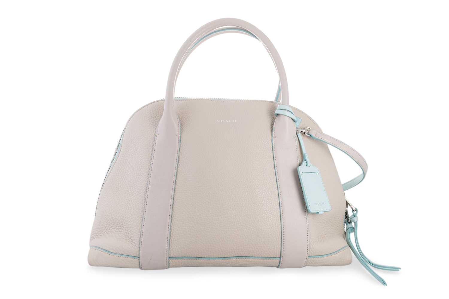 Lot 247 - A LADY'S COACH HAND BAG, cream leather bowling...