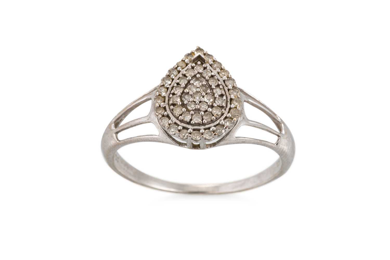 Lot 38 - A PEAR SHAPED DIAMOND CLUSTER RING, mounted in...