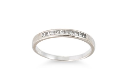 Lot 100 - A DIAMOND SET BAND RING, the princess cut...