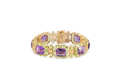 Lot 222 - AN AMETHYST AND PERIDOT SET CLUSTER BRACELET,...
